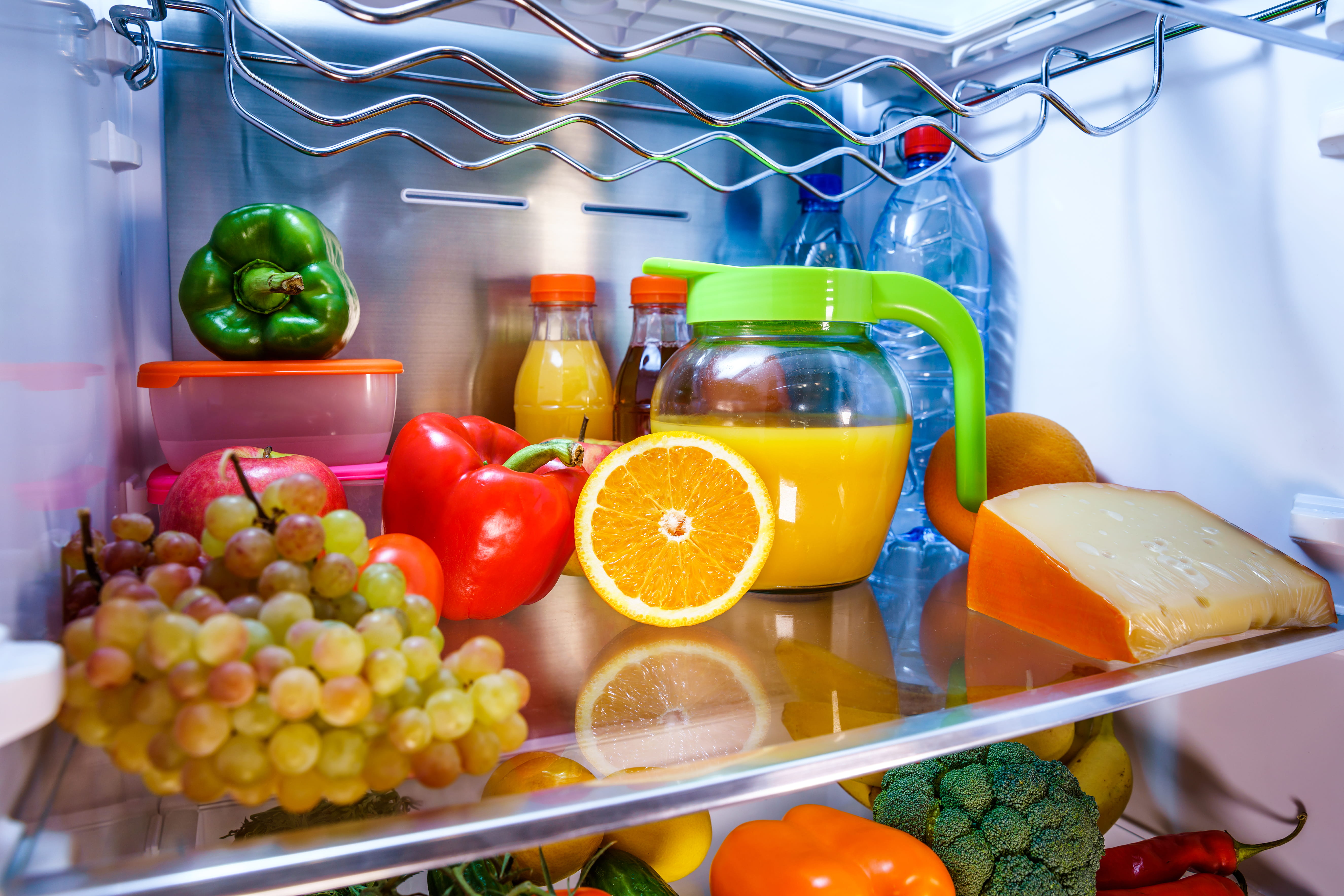Testing repaired fridge temperature before signing off the job